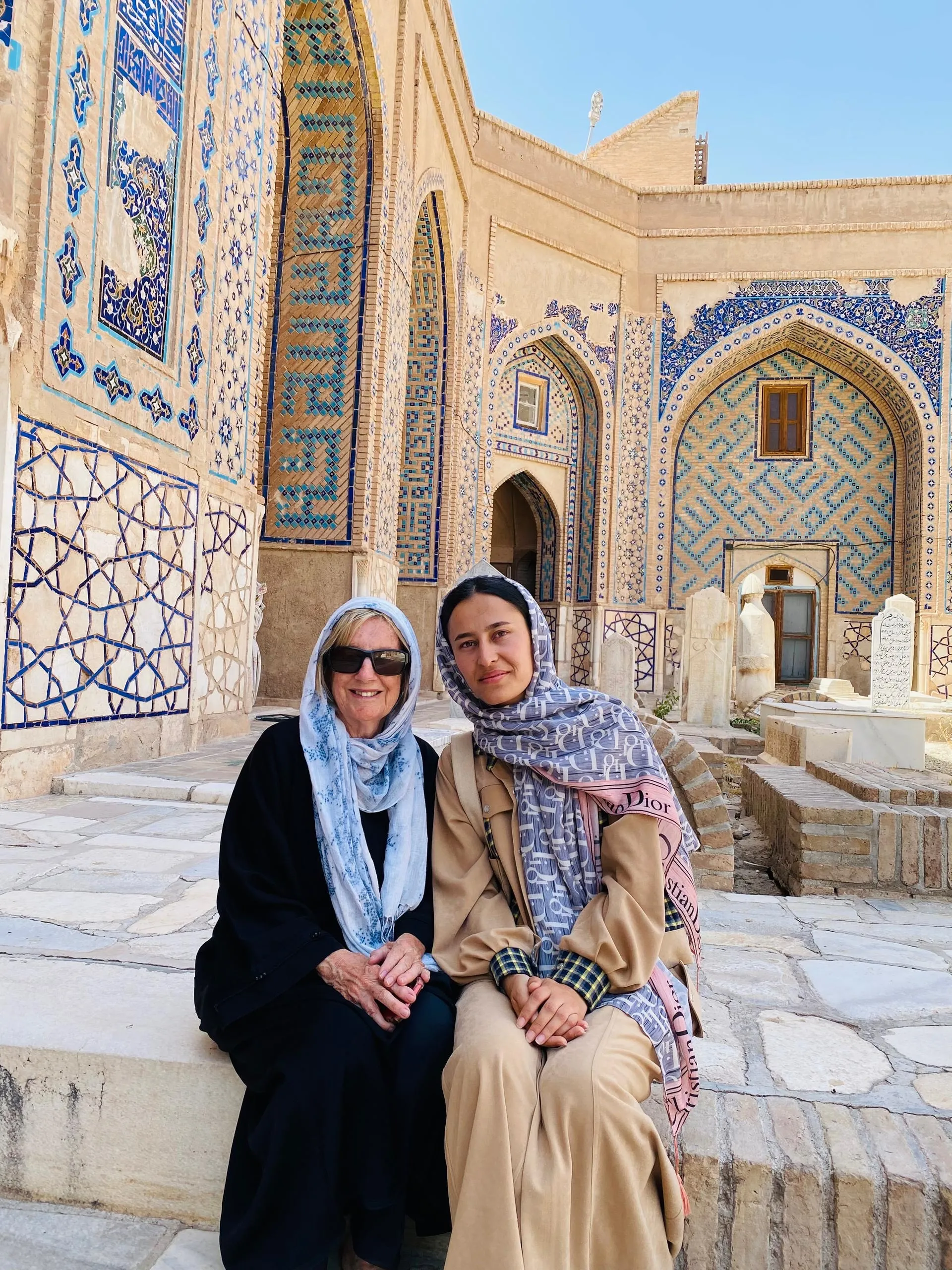 Patricia from Australia with her local female tour guide at the Khaja Abdullah Ansari Shrine in Herat.