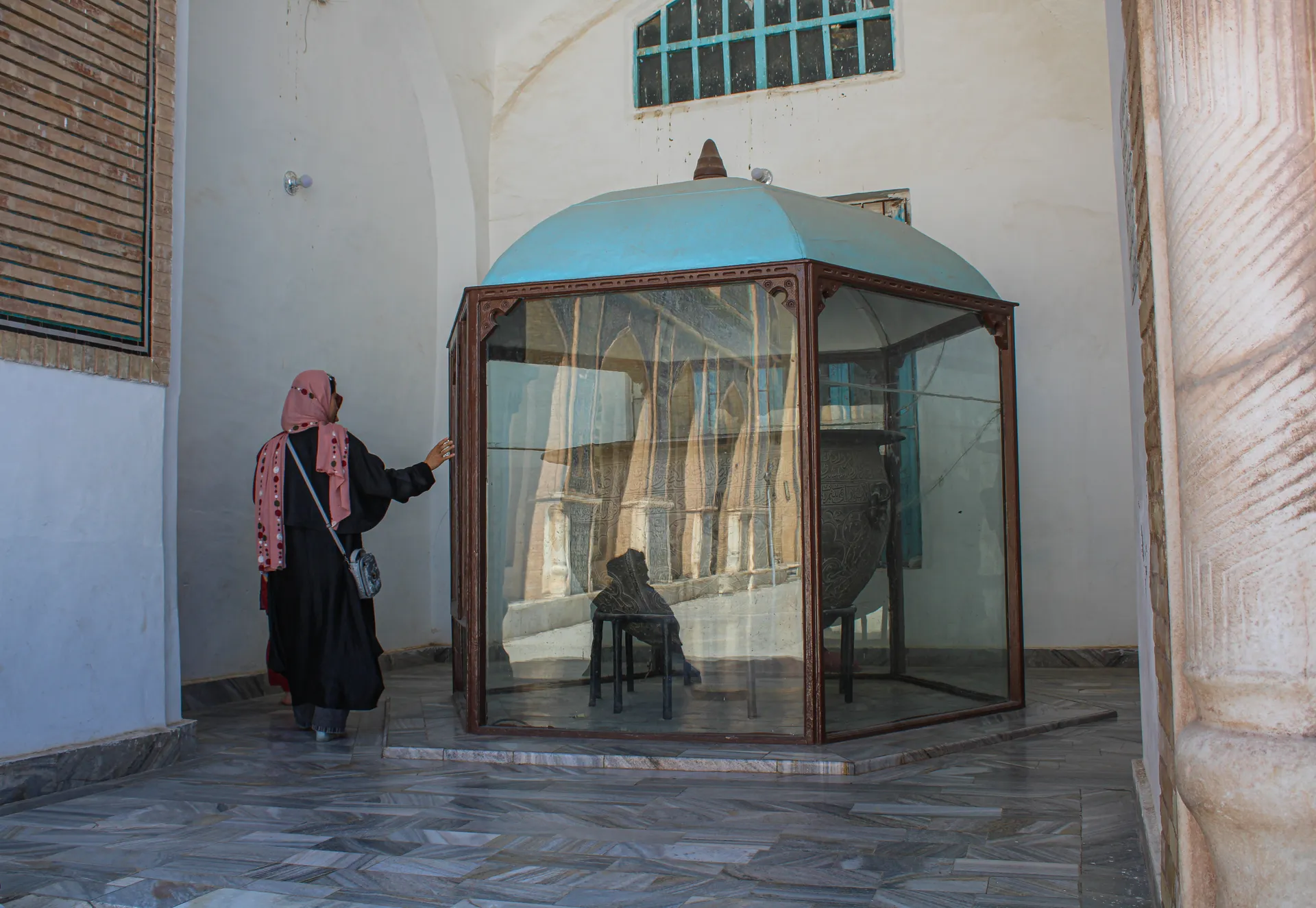 Visiting the sacred pot at the Blue Mosque of Herat — a meaningful moment shared between our solo female traveler and her local female tour guide